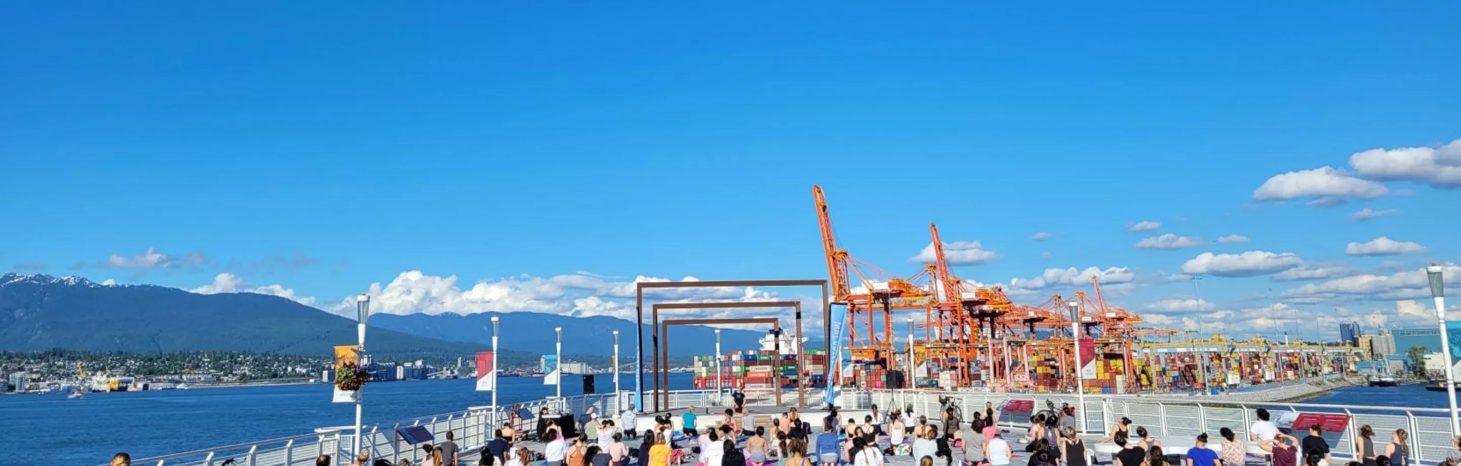 People doing yoga at Canada Place