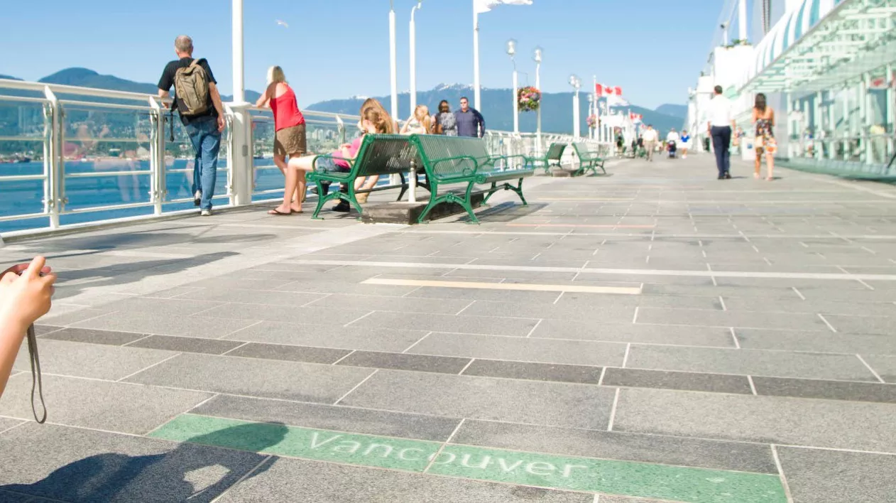 Tourist walking on the promenade at Canada Place 