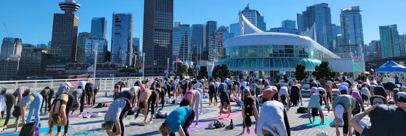 People doing yoga at Canada Place